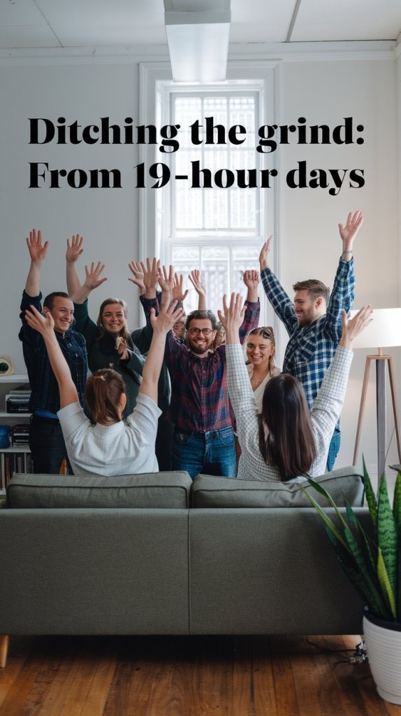 Group of people celebrating together in an office setting, raising their arms in joy, with a couch and indoor plants in the foreground.