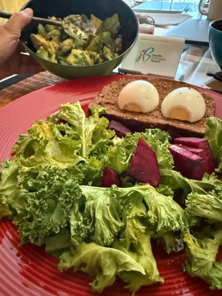 A high-protein brunch featuring hard-boiled eggs on sourdough, fresh kale, and beetroot, part of Jane's muscle-building nutrition plan.